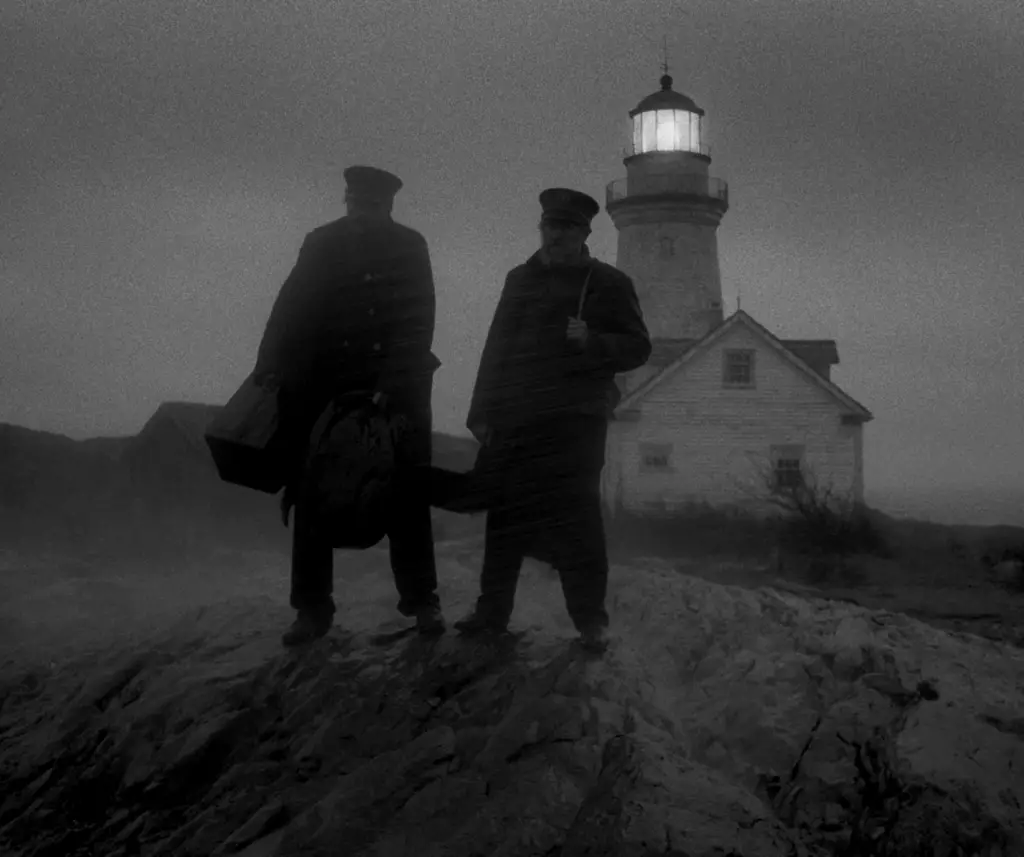 A haunting shot of the lighthouse capturing light and shadow
The characters' distorted reflections enhancing the theme of madness