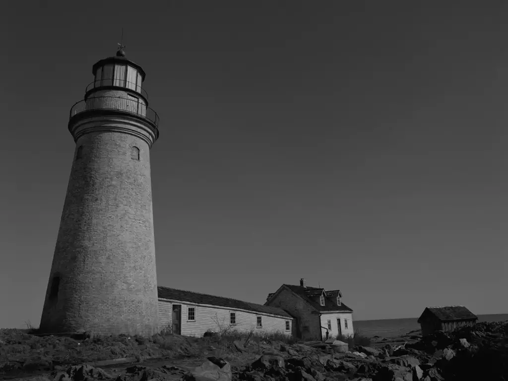 A close-up of the lighthouse symbolizing isolation and identity