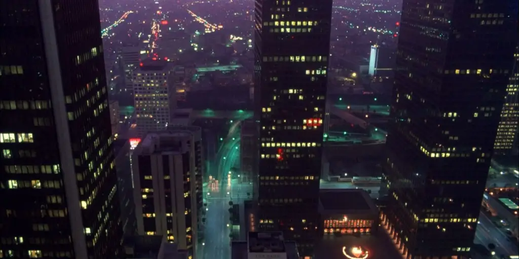 A cityscape illuminated at night, highlighting the hustle of urban life